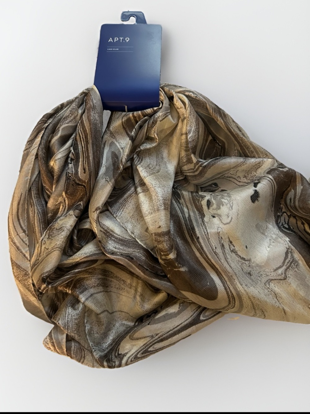 Apt. 9 loop scarf featuring a swirling silver and brown marble pattern.